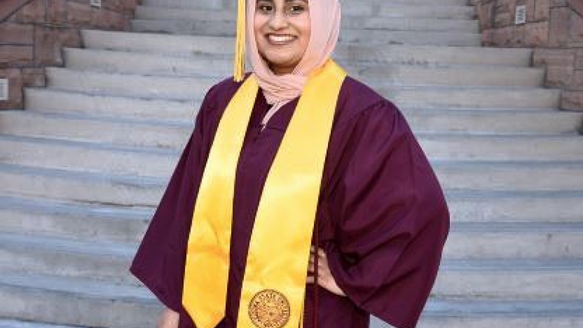ASU interdisciplinary studies graduate Mahnoor Ashraf on steps of Old Main